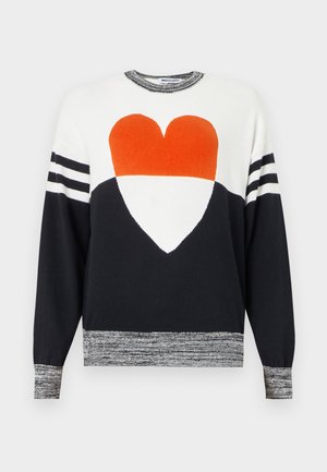 White and black long-sleeve sweater with orange and white heart graphic on front, striped sleeves, and marled cuffs and hem.
