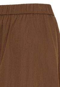 Jupe en tissu marron avec une ceinture élastique, présentant une texture subtile et une finition lisse.