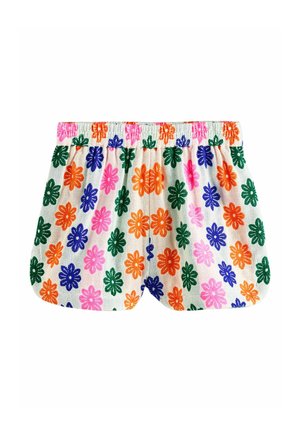 Witte shorts met elastische tailleband en een kleurrijk bloemmotief met oranje, roze, groene en blauwe bloemen op een gestructureerde stof.