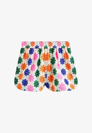 Weiße Shorts mit elastischem Bund und einem bunten Blumenmuster mit orangefarbenen, pinken, grünen und blauen Blumen auf strukturiertem Stoff.