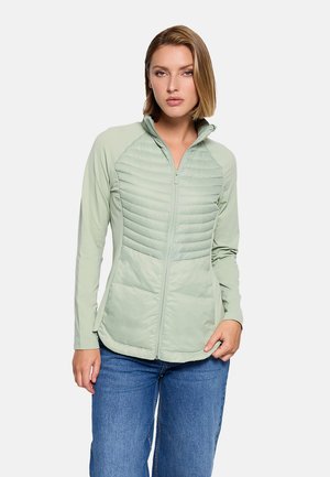 Chaqueta verde claro con cremallera, con un frente acolchado, mangas lisas y un cuello alto. Fabricada con materiales suaves y ligeros.