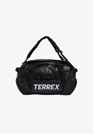 Čierna športová taška z hladkého, nepremokavého materiálu. Má pevné rukoväte a nastaviteľný ramenný popruh. Výrazné biele logo "TERREX".