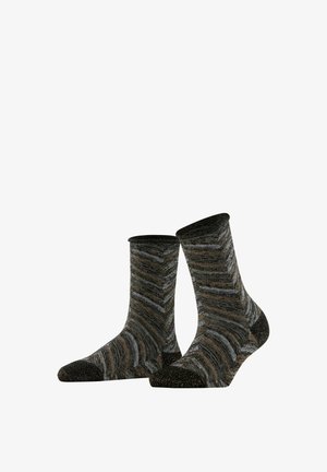 Een paar sokken tot halverwege de kuit met zwarte, grijze en bruine zigzagpatronen en effen zwarte tenen en hielen op een witte achtergrond.