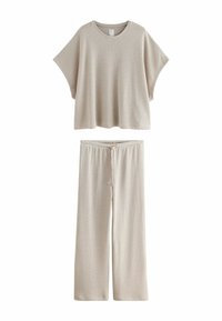 Hellbeiges gestreiftes Lounge-Set mit einem locker sitzenden Kurzarmoberteil und weiten Hosen mit elastischem Bund und Kordelzug.