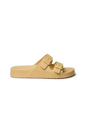 Yellow, synthetic slide sandal with two adjustable buckle straps. Flat sole with textured grip, rounded shape, and minimalistic design.