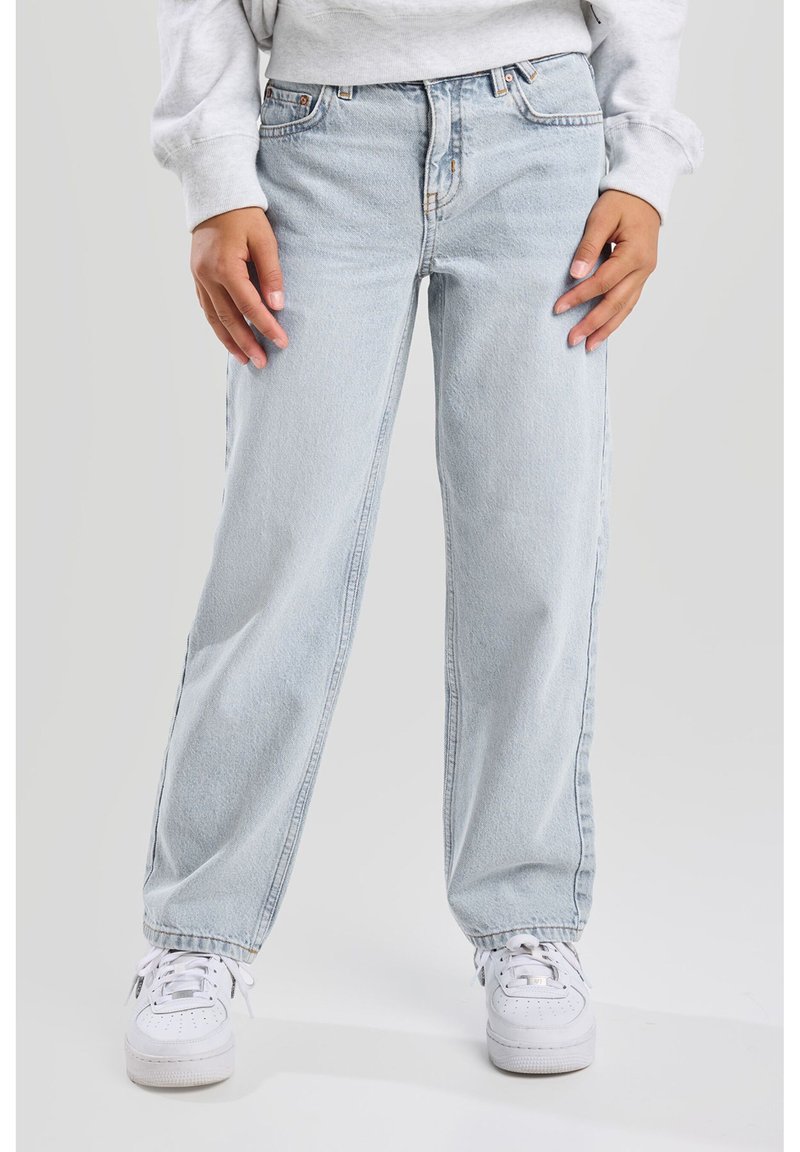Light blue, high-waisted denim jeans with a relaxed fit, featuring a five-pocket design and belt loops, paired with white sneakers.