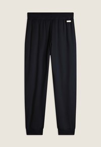 Pantaloni sportivi neri con una texture liscia, vita elastica e polsini aderenti alle caviglie. Nessun motivo visibile o dettagli metallici.
