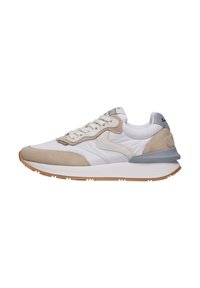 Sneakers with a mix of white fabric and beige suede, featuring a gray accent on the heel, rounded toe, and textured rubber outsole.