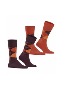 Ensemble de quatre chaussettes en bordeaux et orange. Deux paires unies orange et deux paires à motif argyle en orange et bordeaux avec des formes de diamant.