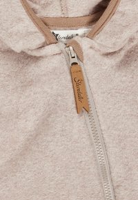 Light pink fleece hoodie with a silver zipper, tan accents, and a leather zipper pull featuring the brand name "Sterntal."