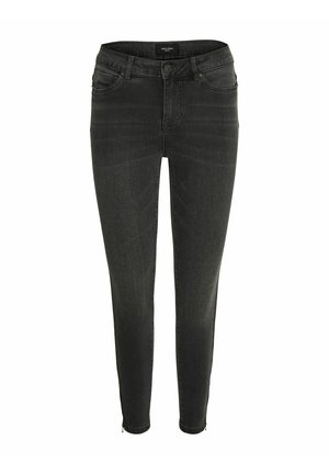 Jeans skinny negros con cierre frontal de botón y cremallera, presillas para cinturón y bolsillos delanteros y traseros, mostrados sobre un fondo blanco.