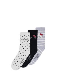Tres pares de calcetines de algodón: blancos con lunares negros, negros con la cara de Hello Kitty y rayados grises con Hello Kitty.