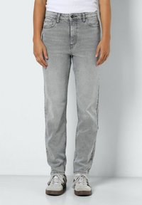 Gray denim jeans with a straight-cut design, featuring five pockets, belt loops, and a faded texture. Paired with light gray sneakers.
