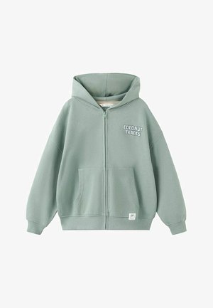 Lichtgroene hoodie met ritssluiting en voorzakken, tekst ""Coconut Traks"" op de borst en klein palmboomlogo vlakbij de zoom.