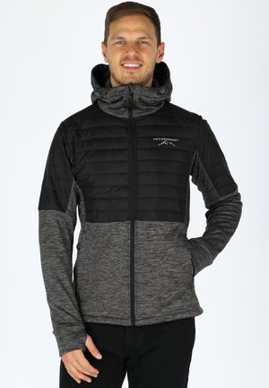 Black and gray zip-up jacket with a padded upper section, soft texture, adjustable hood, and front pockets. Logo on the chest.