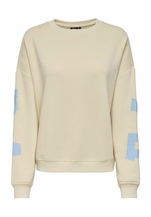 Sweat-shirt couleur crème avec des lettres en blocs bleu clair sur les deux manches, col rond, poignets et ourlet côtelés.
