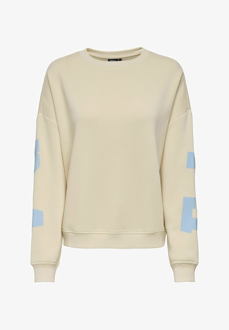 Sweat-shirt couleur crème avec des lettres en blocs bleu clair sur les deux manches, col rond, poignets et ourlet côtelés.