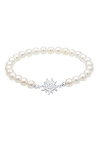 Pärlarmband med alternerande vita och krämfärgade pärlor, utrustat med en silverfärgad edelweissblomma som lås för säker stängning och dekorativ detalj.