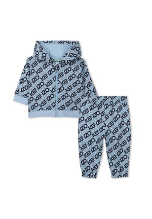 Light blue zip-up hoodie with black repeating logo patterns, paired with matching pants. Soft fabric and relaxed fit.
