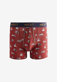 Rote Boxershorts mit einem sechseckigen Muster, dekoriert mit kleinen Hundillustrationen. Der Bund ist navy und trägt das Branding "NEXT".