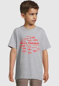 Gray t-shirt featuring a red graphic print of various fish and the text "Merry Fishmas" in bold letters. Short sleeves, crew neck design.