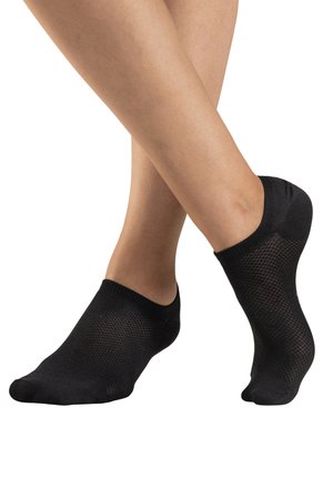Black ankle socks made of a textured, breathable material, featuring a low-cut design that exposes the ankle.