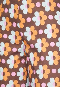 Résumé Spodnie materiałowe