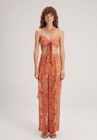 adL FLYWELL - Pantalones - Printed Orange