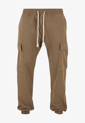 Smeđe cargo hlače s elastičnim pojasom i manžetama, bijelim vezicama i džepovima s poklopcem na svakom bedru.