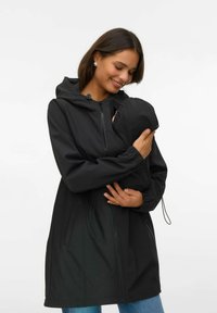 Must kapuutsiga jakk lukuga ees, elastsete mansettide ja küljetaskutega, millel on sisseehitatud kott beebile või lapsele. Sile kangapind.