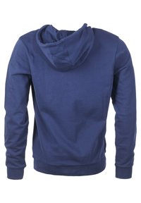 Tummansinisestä pehmeästä puuvillasta valmistettu huppari, jossa on yhteensopiva huppu ja ribbauskättyrit. Takakuvassa näkyy yksinkertainen, koristelematon muotoilu.