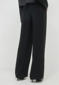 Calliope PALAZZO BANDA STRASS - Pantaloni - ultrablack
