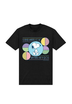 Black t-shirt with Snoopy sitting in a blue circle surrounded by pastel-colored geometric shapes and text "I never wanted to be anything but a dog."