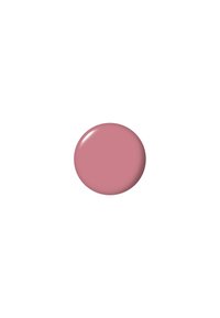 Tondo, lucido campione di vernice rosa pallido con una texture liscia su uno sfondo bianco.
