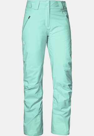 Mintgrønne skibukser lavet af holdbart, vandafvisende materiale. Har en lomme med lynlås og forstærket syning for øget holdbarhed.