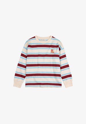 Dugih rukava, kremasti pamučni majica s naizmjeničnim plavim i burgundskim prugama. Ima malu izvezenu crvenu stolicu na prsima.