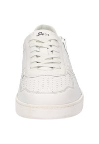 White leather sneakers with perforated detailing, flat laces, and side zipper. Features a textured sole and minimal branding near the tongue.