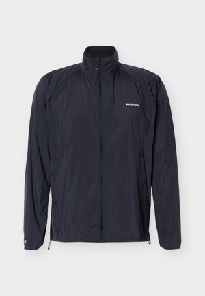 Veste noire légère Salomon avec fermeture éclair complète à l'avant et col montant, conçue pour les activités de plein air.