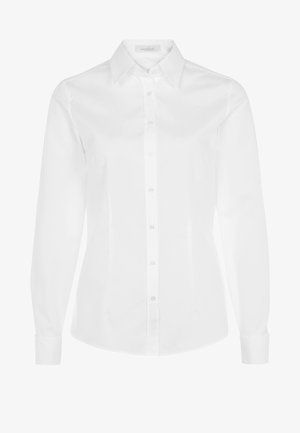 Camicia bianca a maniche lunghe con colletto a scomparsa, chiusura frontale con bottoni e vestibilità strutturata. Realizzata in tessuto leggero e liscio.