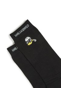 Crne pamučne čarape s kartonskim patkom s naočalama i maramom, izvezene sa strane, zajedno s imenom brenda "Karl Lagerfeld."