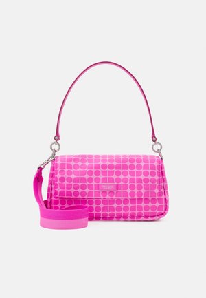 Bright pink handbag with geometric circle and square patterns, detachable wide strap, and slim top handle against a white background.