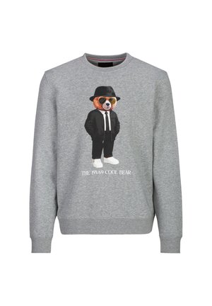 Grijze trui met een afbeelding van een beer die een zwart pak, hoed, zonnebril en witte schoenen draagt met de tekst "THE 19V69 COOL BEAR" eronder.