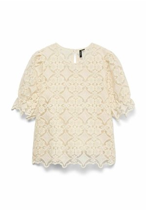 Kreminė nėriniuota palaidinė su pūstomis rankovėmis, gėlių raštu ir banguotu apvadu. Yra rakto skylutės nugaros užsegimas ir tekstūruota medžiaga.