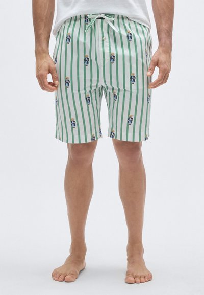 Bañador a rayas verdes y blancas con un patrón divertido de osos, cintura con cordón y tejido ligero. Diseño a la altura de la rodilla.
