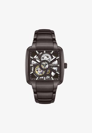 Black rectangular automatic watch with a skeleton dial, silver accents, and a brushed metal bracelet. Notable gear details visible.