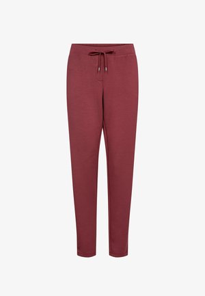 Pantalones deportivos marrones hechos de tela suave, con cintura ajustable con cordón, corte slim, puños elásticos y sin patrones o detalles visibles.