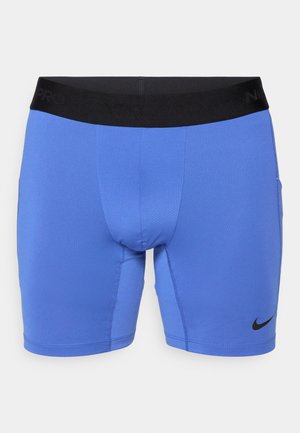 Calções atléticos azuis feitos de tecido elástico, com um cós elástico preto com o texto "Nike Pro" e um pequeno logo preto no canto inferior esquerdo.