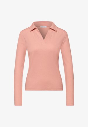 Dames top met lange mouwen in roze, met een V-hals en een licht geribbelde structuur, weergegeven tegen een witte achtergrond.