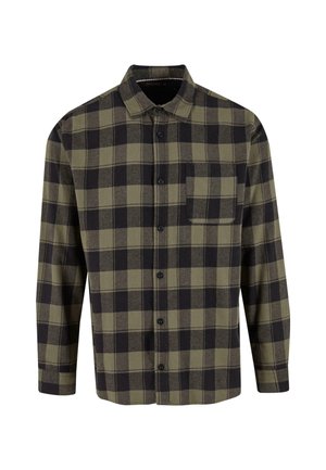 Kockovaná flanelová košeľa v tmavozelenej a čiernej farbe. Má dlhé rukávy, golier a náprsné vrecko. Vyrobená z mäkkej textúrovanej tkaniny.