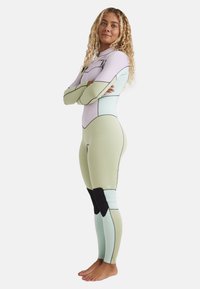 Full-body wetsuit featuring pastel lilac, mint green, and black accents. Slim fit design with long sleeves and contrasting seams.